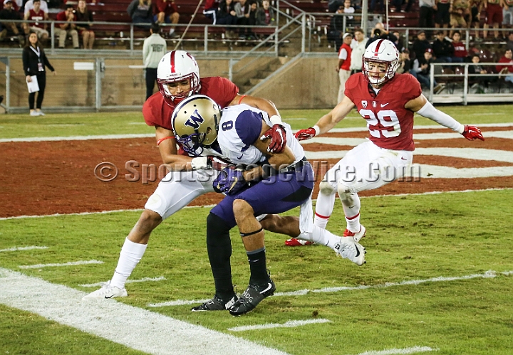 2015StanWash-068.JPG - Oct 24, 2015; Stanford, CA, USA; Washington Huskies wide receiver Dante Pettis (8) is pushed out of bounds by Alijah Holder (13) after catching a 33 yards pass in the fourth quarter against the Stanford Cardinal at Stanford Stadium. Stanford beat Washington 31-14.